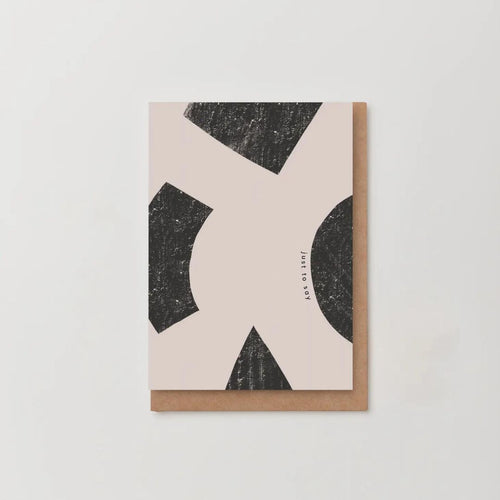abstract style greetings card in very light pink and black with 'just to say' written at an angle on the card 